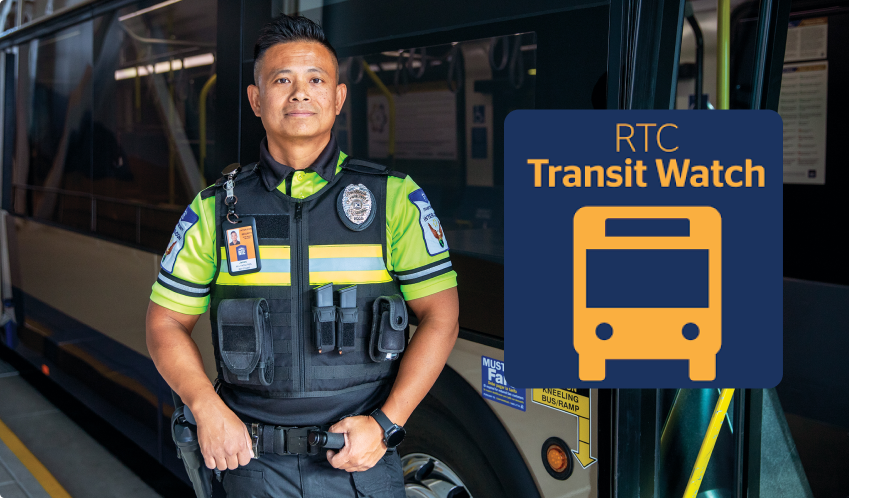 Transit Watch App updated A uniformed transit security officer stands beside a bus. Next to him is a blue and yellow sign that reads RTC Transit Watch with an icon of a bus below the text.